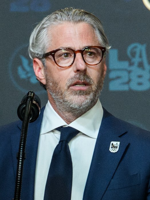 Prahara di balik gelanggang. Ketua Komite Penyelenggara Olimpiade Los Angeles 2028, Casey Wasserman, menghadapi desakan mundur massal setelah rilis dokumen Epstein mengungkap komunikasi 