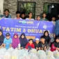 Penyerahan simbolis bantuan bakti sosial Ramadan di Al-Wildan Islamic School 3 BSD City. (Posnews/Ist)