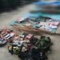 Barang bukti uang tunai, 18 telepon seluler, alat komunikasi, dan senjata yang diamankan TNI usai kontak tembak di Nduga.

